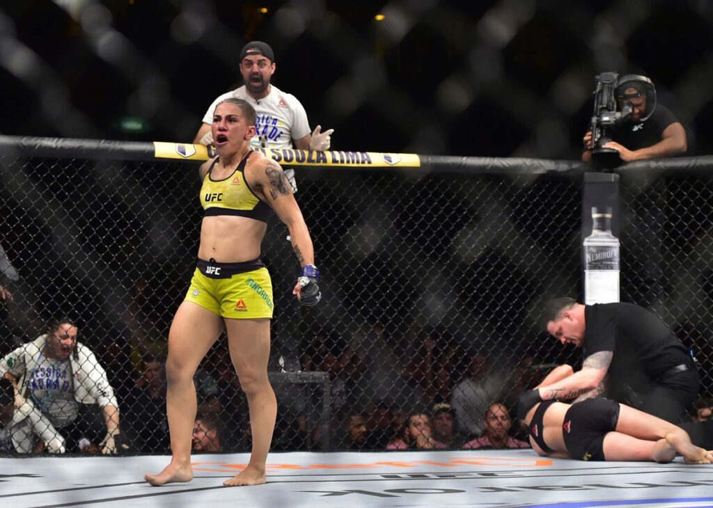 May 11, 2019; Rio de Janeiro, Brazil; Jessica Andrade (blue gloves) reacts to fight against Rose Namajunas (red gloves) during UFC 237 at Jeunesse Arena. Mandatory Credit: Jason Silva-USA TODAY Sports