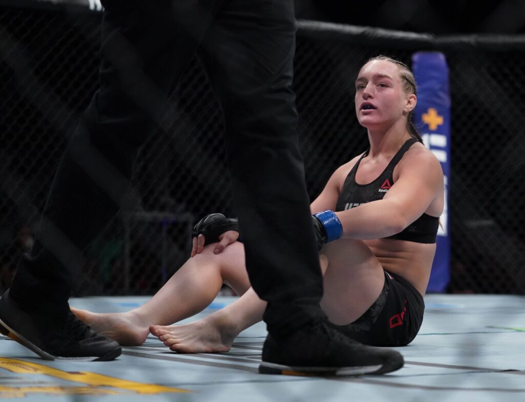July 13, 2019; Sacramento, CA, USA; Aspen Ladd (blue gloves) after losing to Germaine de Randamie (red gloves) during UFC Fight Night-Sacramento at Golden 1 Center. Mandatory Credit: Kyle Terada-USA TODAY Sports