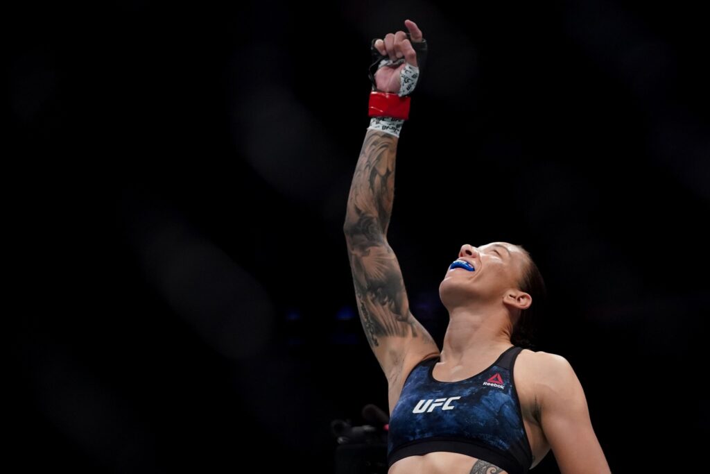 July 13, 2019; Sacramento, CA, USA; Germaine de Randamie (red gloves) fights Aspen Ladd (blue gloves) during UFC Fight Night-Sacramento at Golden 1 Center. De Randamie defeated Ladd via TKO (punch) – Round 1, 0:16. Mandatory Credit: Kyle Terada-USA TODAY Sports