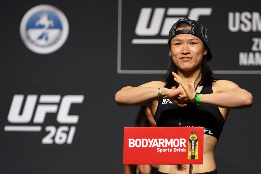 Apr 23, 2021; Jacksonville, Florida, USA; Zhang Weili gestures while on the scale during weigh-ins for UFC 261 at VyStar Veterans Memorial Arena. Mandatory Credit: Jasen Vinlove-USA TODAY Sports
