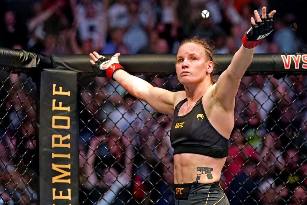 Apr 24, 2021; Jacksonville, Florida, USA; Valentina Shevchenko (Red Gloves) fights Jessica Andrade (Blue Gloves) during UFC 261 at VyStar Veterans Memorial Arena. Mandatory Credit: Jasen Vinlove-USA TODAY Sports