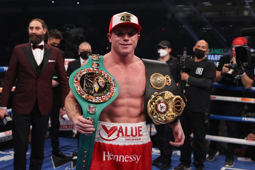 Dec 19, 2020; San Antonio, TX, USA; Canelo Alvarez (red trunks) celebrates after defeating Callum Smith (white trunks) during their WBA, WBC and Ring Magazine super middleweight championship bout at the Alamodome in San Antonio, TX. Mandatory Credit: Ed Mulholland/Handout Photo via USA TODAY Sports