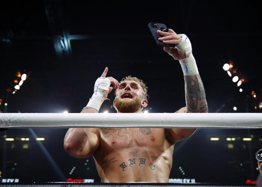 Dec 18, 2021; Tampa, FL, USA; Jake Paul celebrates after defeating Tyron Woodley at Amalie Arena. Mandatory Credit: Kim Klement-USA TODAY Sports