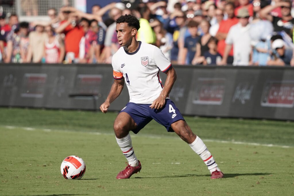 Jun 5, 2022; Kansas City, Kansas, USA; USA midfielder Tyler Adams (4) controls the ball against against Uruguay during an international friendly soccer match at Children's Mercy Park. Mandatory Credit: Denny Medley-USA TODAY Sports