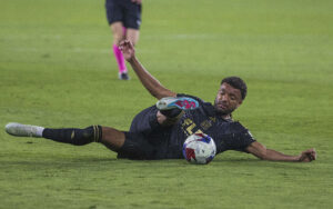 March 25, 2023, Los Angeles, California, USA: Timothy Tillman 11 of the LAFC slips while attempting to pass the ball during their MLS, Fussball Herren, USA game against FC Dallas on Saturday March 25, 2023 at the BMO Stadium in Los Angeles, California. LAFC defeats FC Dallas, 2-1. /PI Los Angeles USA - ZUMAp124 20230325_zaa_p124_029 Copyright: xARIANAxRUIZx