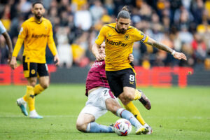 Wolverhampton Wanderers v Aston Villa Premier League 06/05/2023. Wolverhampton Wanderers midfielder Ruben Neves 8 battles for possession with Aston Villa midfielder John McGinn 7 during the Premier League match between Wolverhampton Wanderers and Aston Villa at Molineux, Wolverhampton, England on 6 May 2023. Wolverhampton Molineux West Midlands England Editorial use only DataCo restrictions apply See www.football-dataco.com , Copyright: xManjitxNarotrax PSI-17412-0081