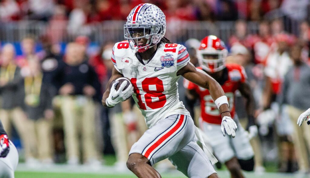 2022 Chick-fil-a Peach Bowl: Ohio State vs Georigia DEC 31 December 31, 2022: Ohio State Buckeyes wide receiver Marvin Harrison Jr. 18 runs for a first down during the first half of the 2022 Chick-fil-a Peach Bowl against the Georgia Bulldogs at Mercedes-Benz Stadium in Atlanta, GA. Scott Kinser/CSM/Sipa USACredit Image: Scott Kinser/Cal Media/Sipa USA Atlanta Mercedes-Benz Stadium GA United States NOxUSExINxGERMANY PUBLICATIONxINxALGxARGxAUTxBRNxBRAxCANxCHIxCHNxCOLxECUxEGYxGRExINDxIRIxIRQxISRxJORxKUWxLIBxLBAxMLTxMEXxMARxOMAxPERxQATxKSAxSUIxSYRxTUNxTURxUAExUKxVENxYEMxONLY Copyright: xCalxSportxMediax Editorial use only