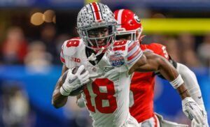 NCAA, College League, USA Football 2022: Chick-fil-A Peach Bowl: Ohio State vs Georgia DEC 31 December 31, 2022: Ohio State s Marvin Harrison Jr. 18 carries the ball during the Chick-fil-A Peach Bowl a College Football Playoff Semifinal featuring the 4 Ohio State Buckeyes and the 1 Georgia Bulldogs, played at Mercedes-Benz Stadium in Atlanta, Georgia. The Georgia Bulldogs come from behind to defeat Ohio State, 42-41. Cecil Copeland/MarinMedia.org/CSM/Sipa USACredit Image: Cecil Copeland/Cal Media/Sipa USA Atlanta Mercedes-Benz Stadium Georgia United States of America NOxUSExINxGERMANY PUBLICATIONxINxALGxARGxAUTxBRNxBRAxCANxCHIxCHNxCOLxECUxEGYxGRExINDxIRIxIRQxISRxJORxKUWxLIBxLBAxMLTxMEXxMARxOMAxPERxQATxKSAxSUIxSYRxTUNxTURxUAExUKxVENxYEMxONLY Copyright: xCalxSportxMediax Editorial use only