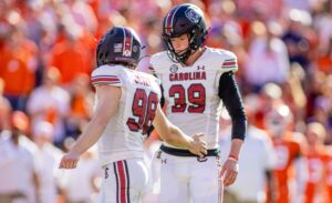 November 26, 2022: South Carolina Gamecocks place kicker Mitch Jeter 98 celebrates with punter Kai Kroeger 39 after a point after try during the second half of the NCAA, College League, USA Football match up against the Clemson Tigers at Memorial Stadium in Clemson, SC.  /CSM Clemson United States - ZUMAc04_ 20221126_zaf_c04_050 Copyright: xScottxKinserx
