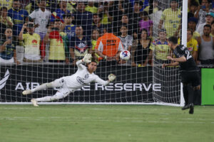 NASHVILLE, TN - AUGUST 08: Nashville SC defender Daniel Lovitz 2 scores the winning penalty kick past Amrica goalkeeper Luis Malagon 1 during a LeagueÕs Cup Round of 16 match between Nashville SC and Amrica, August 8, 2023 at GEODIS Park in Nashville, Tennessee. Photo by Matthew Maxey/Icon Sportswire SOCCER: AUG 08 Leagues Cup - Nashville SC vs America EDITORIAL USE ONLY Icon23080839