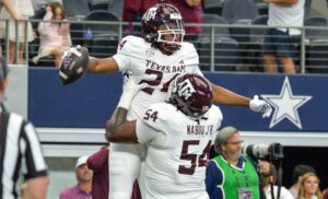 NCAA, College League, USA Football 2023: Southwest Classic Arkansas vs Texas A&M SEP 30 September 30, 2023: Texas A&M Aggies running back Earnest Crownover 24 runs in for a touchdown in the final seconds and celebrates with Texas A&M Aggies offensive lineman Mark Nabou Jr. 54 during the Southwest Classic NCAA Football game of the season between the University of Arkansas Razorbacks and the Texas A&M University Aggies at AT&T Stadium, Arlington,TX. Aggies leads the 1st half against Razorbacks, 17-6. Patrick Green/CSM/Sipa USA Credit Image: Patrick Green/Cal Media/Sipa USA Arkansas AT&T Stadium TX USA NOxUSExINxGERMANY PUBLICATIONxINxALGxARGxAUTxBRNxBRAxCANxCHIxCHNxCOLxECUxEGYxGRExINDxIRIxIRQxISRxJORxKUWxLIBxLBAxMLTxMEXxMARxOMAxPERxQATxKSAxSUIxSYRxTUNxTURxUAExUKxVENxYEMxONLY Copyright: xCalxSportxMediax Editorial use only