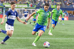 October 7, 2023, Seattle, Washington, USA: Sounders player Nicolas Lodero 10 takes the ball down the field towards the goal as Vancouver Whitecaps player SEBASTIAN BERHALTER 16 comes in from the side , in the 2nd half of the game, Seattle Sounders vs Vancouver Whitecaps which ended in a 0-0 draw. Seattle USA - ZUMAers 20231007_mda_l181_366 Copyright: xMelissaxLevinx
